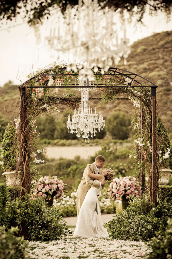 One of the ways to bring the glamorous and graceful feel to your wedding reception is opting for the chandeliers.