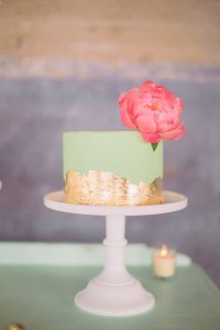 Mint and gold cake with big pink flower
