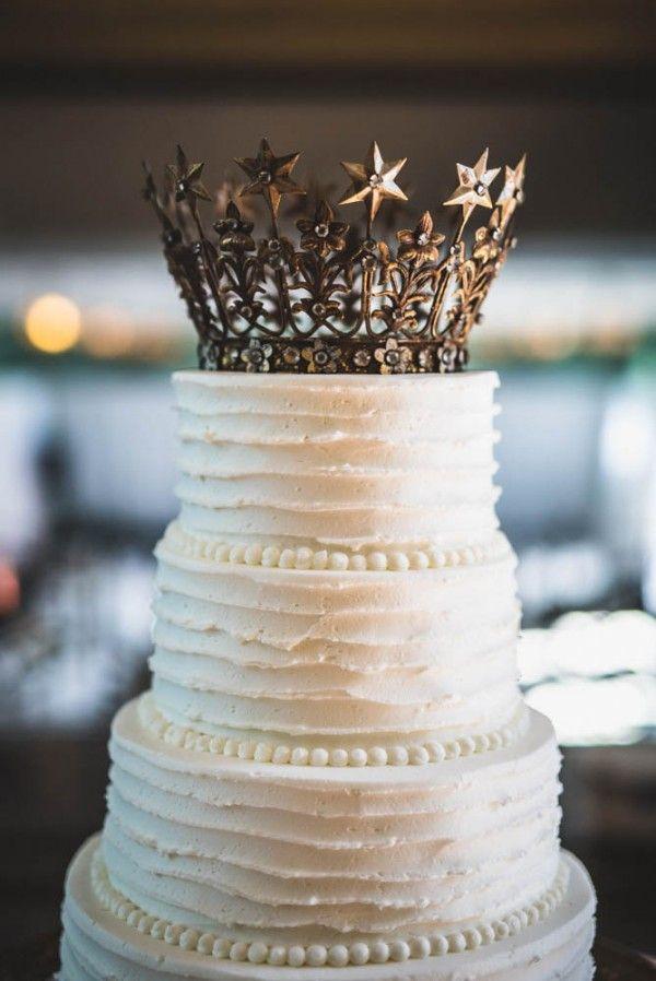 wedding cake with a crown topper